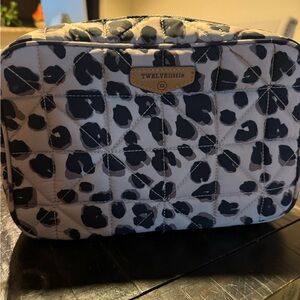 Twelvelittle diaper clutch in leopard print.